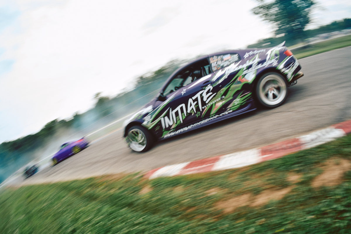 Initiate Motorsports G35 drifting past a curb